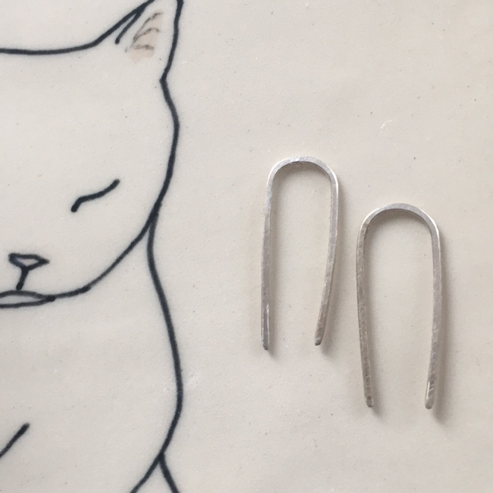 Staple earrings.